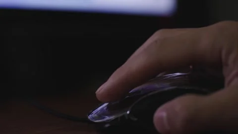The male hand is used by a computer mouse to click and scroll Stock Footage 287269494