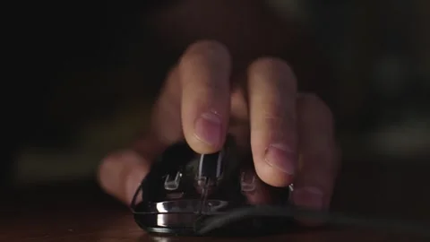 The male hand is used by a computer mouse to click and scroll Stock Footage 287269541