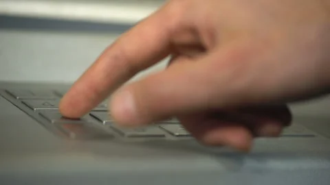 Male hand using ATM, inserting unique personal code and pressing enter button Stock Footage 90911512
