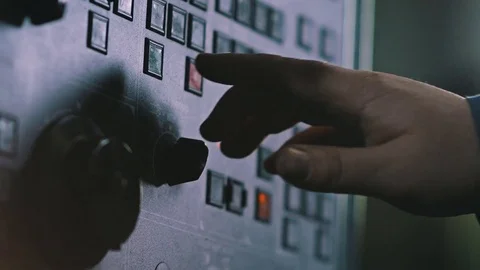 Male hand using buttons and turns levers on panel computer numerical control Stock Footage 83429968