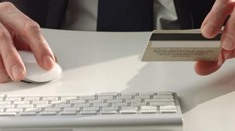 Male hand using computer and credit card for online payment Stock Footage 61034812