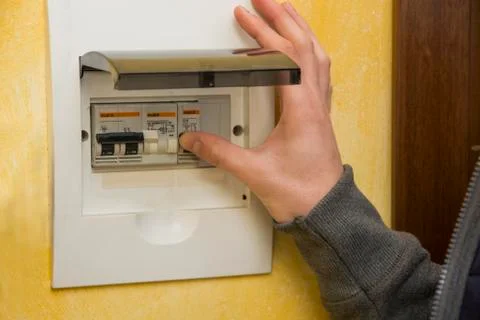 Male hand using an electronic control panel Stock-Fotos