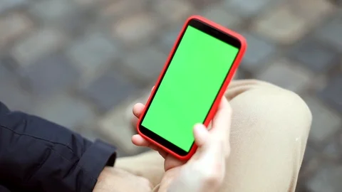 Male hand using green screen smart phone mobile outdoor. Winter holidays. Christ Stock Footage 120971653