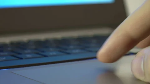 Male hand using laptop touch pad Stock Footage 34654143