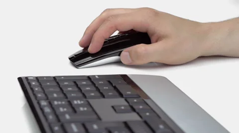 Male hand using a mouse on white table Stock Footage 66565230