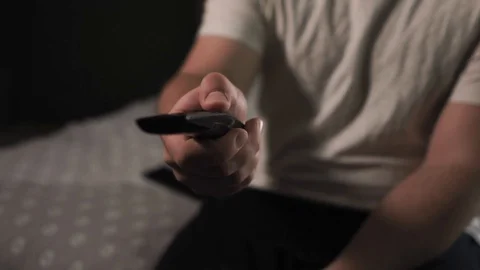 Male hand using TV remote Stock-Footage 126111381