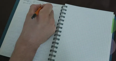 Male hand write notes in notebook 4K 10-bit 스톡 동영상 345258369