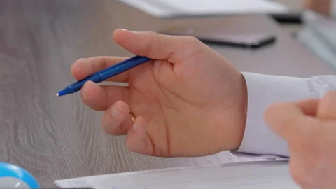 Male hand writes with a pen in a notebook. Closeup. Dolly shot Stock Footage 161953732