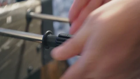 Male hands actively move the table football or kicker control knobs Video stock 124916574