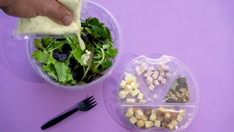 Male hands adding sauce on a prepared salad Stock Footage 170456109