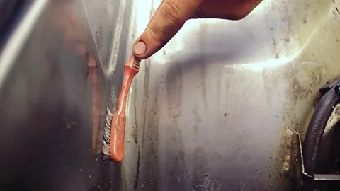 Male hands clean the surface of car parts. Stock Footage 78701804