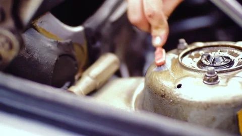 Male hands clean the surface of car parts. Stock Footage 78701908