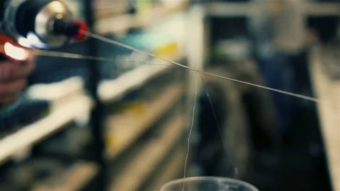 Male hands coil wire for the electronic cigarette. Stock Footage 72930003