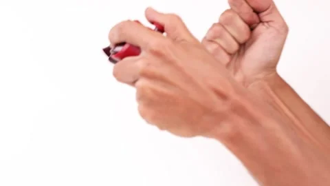 Male Hands on a controller playing video games isolated white celebrating Stock Footage 240486936