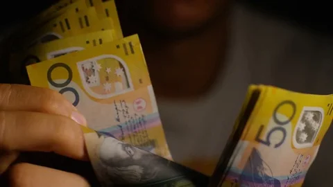 Male hands counting $50 notes in Australian dollars Stock Footage 78066002