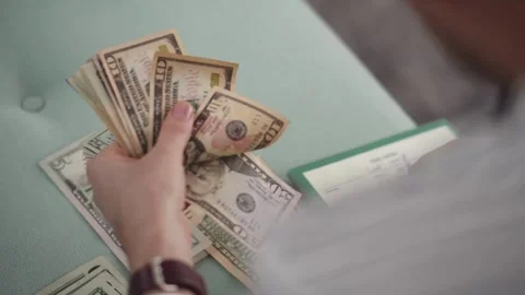 Male hands counting US dollar banknotes, close up view. finance, economy and Stock-Footage 336259652