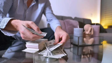 Male hands counting US dollar banknotes, close up view. finance, economy and Stock-Footage 336259946