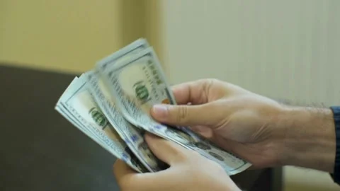 Male hands counting US dollar banknotes, close up view. finance, economy and Stock-Footage 336260144