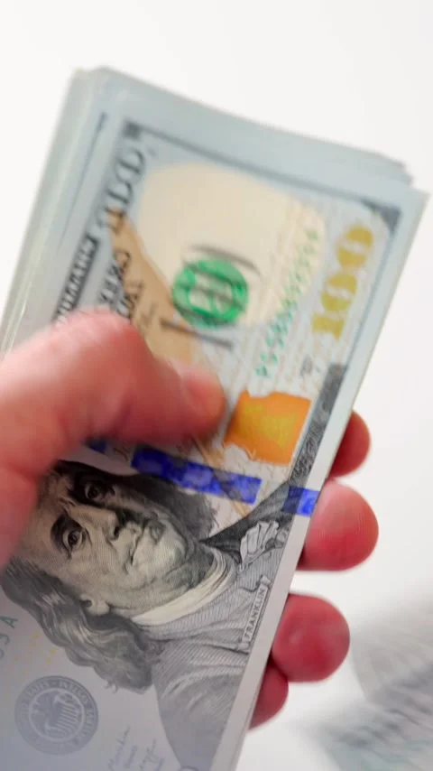 Male hands counting US Dollar bills, close-up Stockbeeldmateriaal 340407663