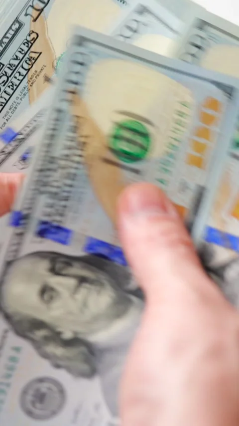 Male hands counting US Dollar bills, close-up Видео 340407882