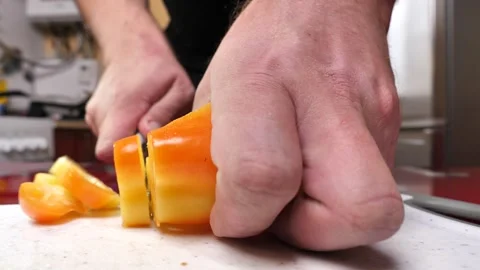 Male hands cutting a yellow bell pepper with a knife on a chopping board 스톡 동영상 255287953