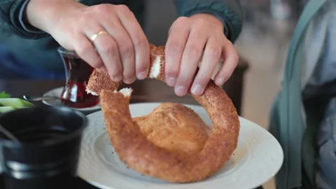 Male hands divide bread into pieces. Breakfast time Stock Footage 190883576