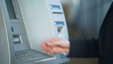 Male hands entering pin code on ATM keyboard, withdrawing money from account Stock Footage 90915524
