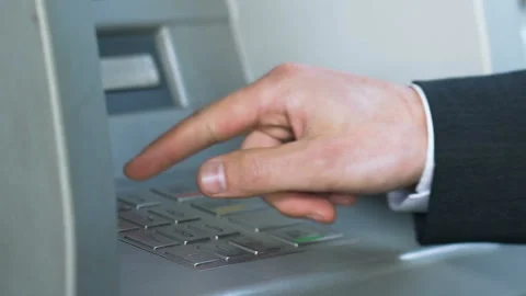 Male hands entering pin code on ATM and receiving Japanese yen, banking service Stock Footage 92603287