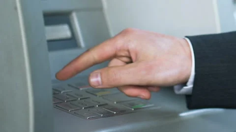 Male hands entering pin code on ATM and receiving Japanese yen, banking service Stock Footage 92603622
