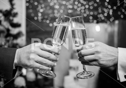 Male hands formal suit hold champagne glasses. Cheers concept. New year Stock Photos