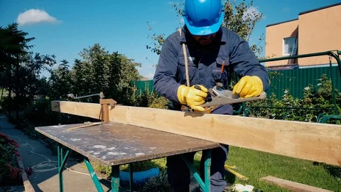 Male hands in gloves work with jack-plan Stock Footage 98301653