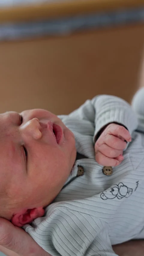 Male hands holding a cute tiny newborn Stock Footage 301880138