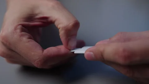 Male hands holding micro SD card and SD card adapter, removing small memory card Stock Footage 320673836