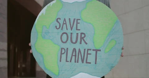 Male hands holding poster while striking against environmental polution. Close Stock Footage 137490480