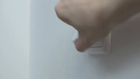 Male hands inserting power plug into the electrical socket on the wall close-up  Stock Footage 158943991