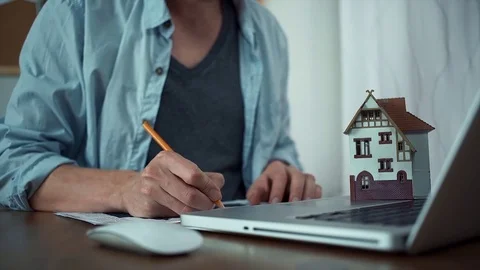 Male hands making note with pencil at printed graphs and uses wireless mouse Stock Footage 79902383