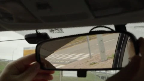 Male hands making precise adjustments to the car's rear view mirror, a safe.. Stock Footage 252021090