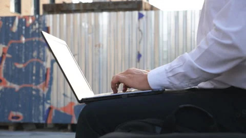 Male hands of manager typing text on notebook keyboard outdoor. Businessman Stock-Footage 308152508