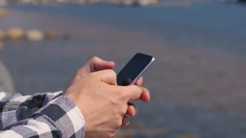 Male hands with a phone close-up. type a message on the phone Stockbeeldmateriaal 118079639