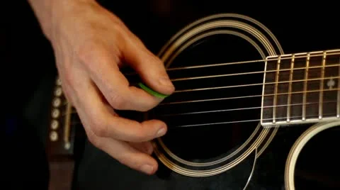 Male hands play on acoustic guitar Stock Footage