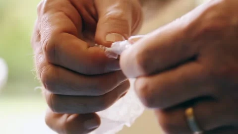 Male Hands Playing with Bubble Wrap for Relaxation - Close Up - 4K Stock Footage 271155716