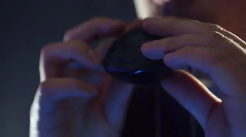 Male hands playing okarina (wind-flute), incense on a dark background. Stock Footage 59643229