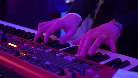 Male hands playing a synth in shallow focus Video stock 83721827