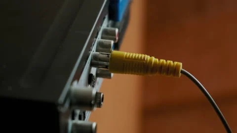 Male Hands Plug-In Rca Cables To Multimedia Electronic Device at Home. Close-Up Stock Footage 167962570
