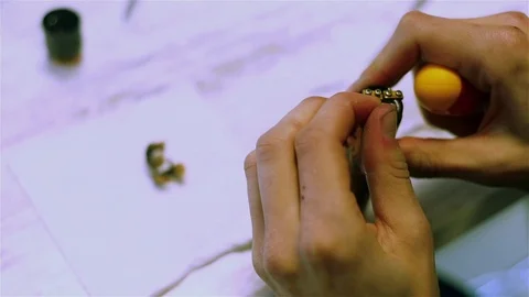 Male hands preload coils of the electronic cigarette. Stock Footage 73178155