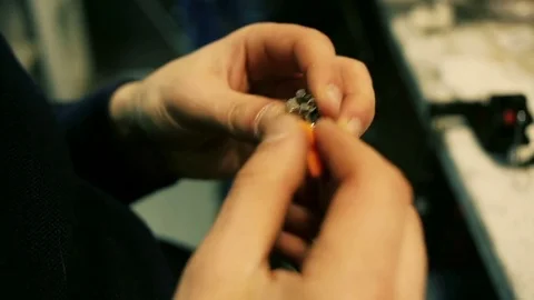 Male hands preload spirals for e-cigarette. Stock Footage 72930101