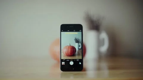 Male hands put the pumpkin on the table. Black Phone Video stock 68155716