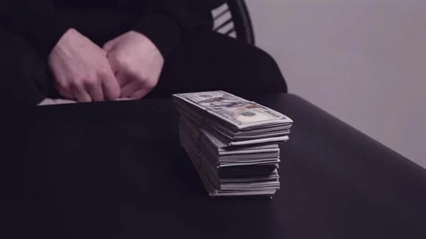 Male hands put a stack of money and dollars on the table, concept of bribe Stock Footage 309665455