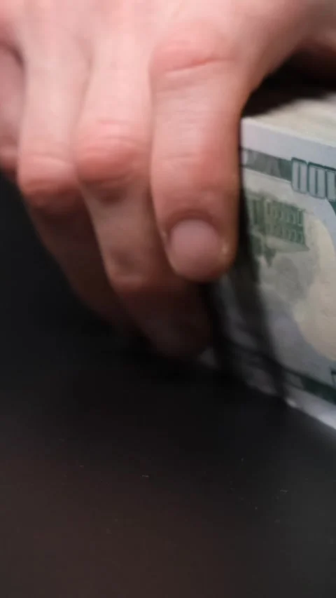 Male hands put a stack of money and dollars on the table, concept of bribe Stock Footage 311797343