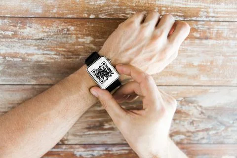 Male hands with qr code on smart watch 库存照片